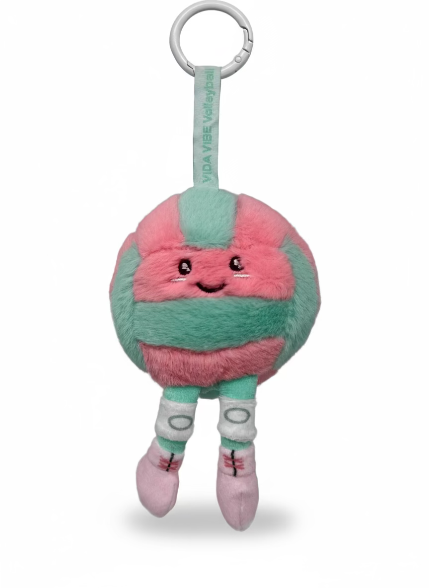 Plush volleyball with a pink and green design on a gray background